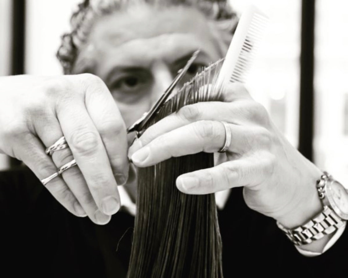 Anthony Cristiano cutting hair using Leonor Greyl luxury hair products