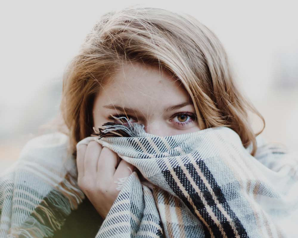 girl with plaid blanket