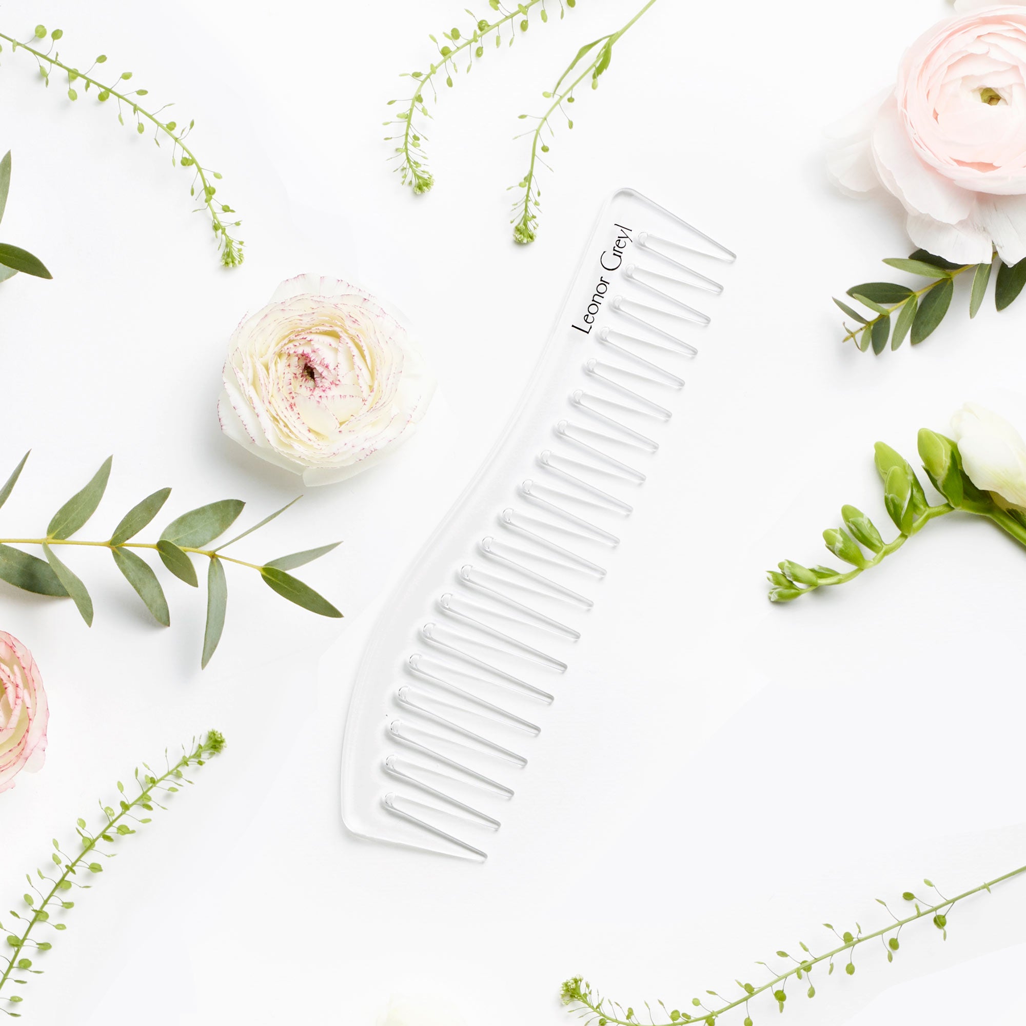 leonor greyl detangling comb with pink flowers and greenery