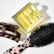 Leonor Greyl tortoise shell care brush and L'Huile de Leonor Greyl and hair clip