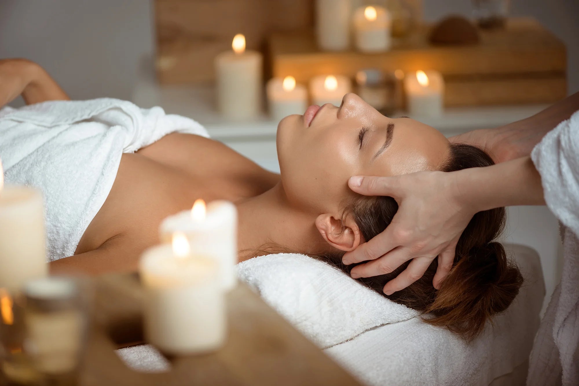 young-woman-having-face-massage-relaxing-spa-salon.webp