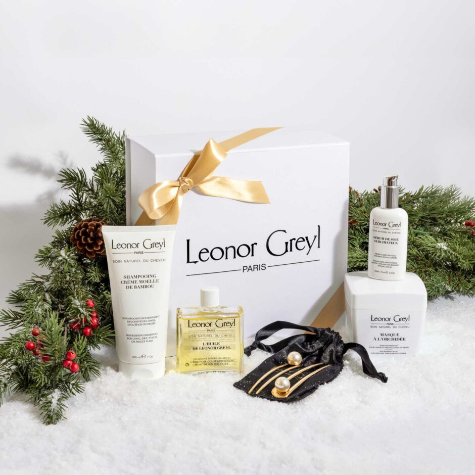 Leonor Greyl 2023 holiday gift box with hair products and hair pins, with greenery and holly