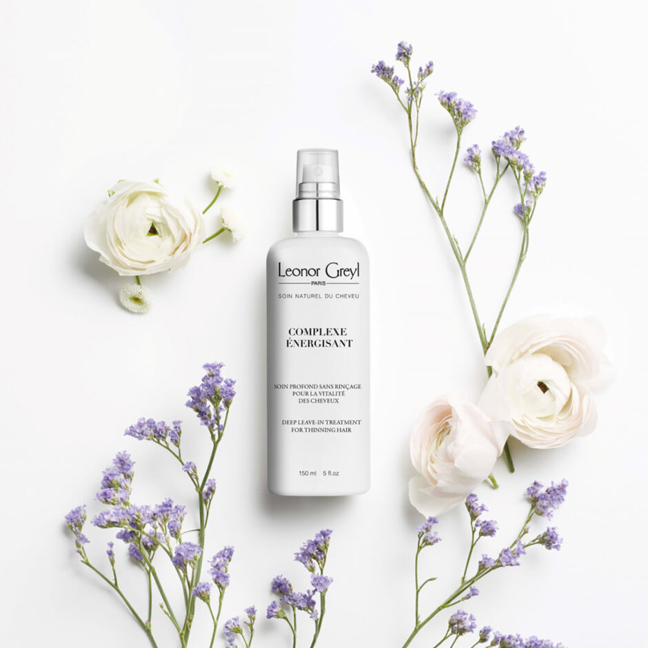 Complexe Énergisant Leonor Greyl new packaging surrounded by florals