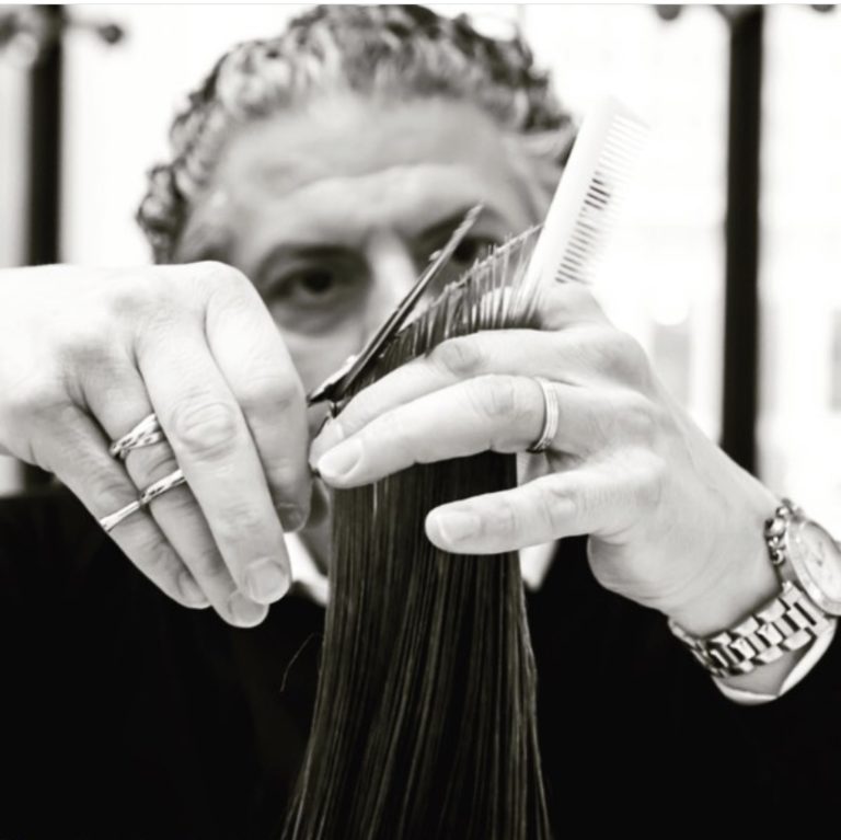 Anthony Cristiano cutting hair using Leonor Greyl luxury hair products