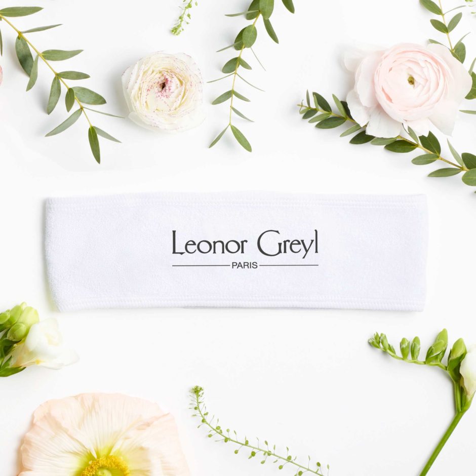 leonor greyl spa headband with flowers and greenery